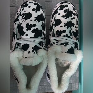 Cow print slide on shoes, fuzzy in the inside